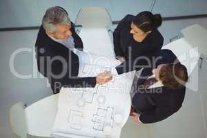 High angle view of businesspeople shaking hands
