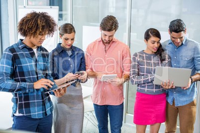 Executives using laptop, digital tablet and mobile phone Executives using laptop, digital tablet and mobile phone