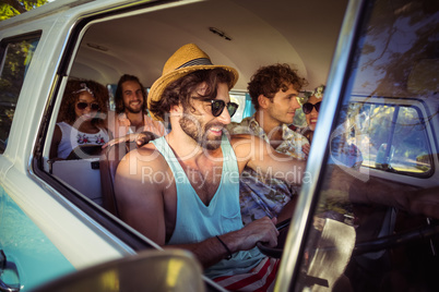 Group of friends travelling in campervan