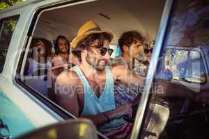 Group of friends travelling in campervan