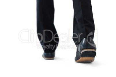 Businessman walking on while background