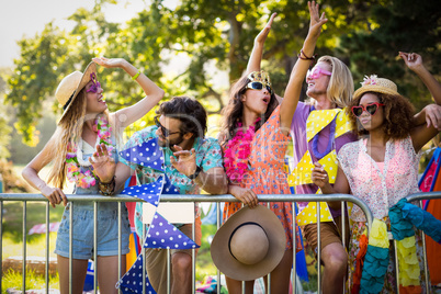 Group of friends dancing at music festival