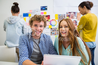 Portrait of executive with digital tablet in office