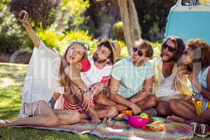 Group of happy friend taking a selfie in park