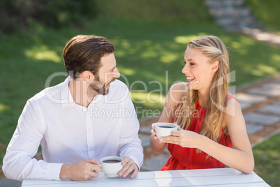 Happy couple having coffee