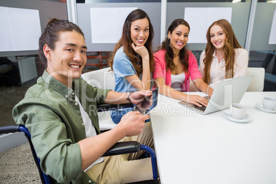 Portrait of smiling executives in conference room