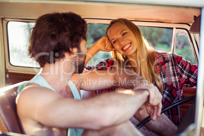 Couple sitting in a campervan