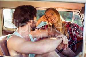 Couple sitting in a campervan