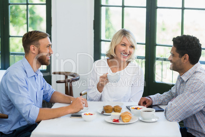 Executives interacting with each other in a restaurant