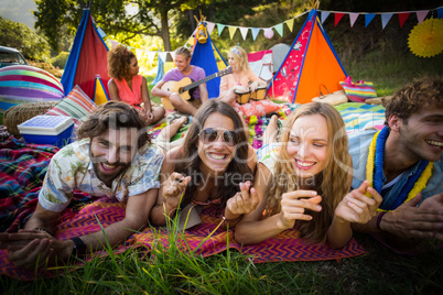 Group of friends posing together at campsite