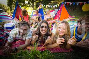 Group of friends posing together at campsite