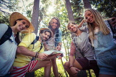 Group of friends standing together in forest