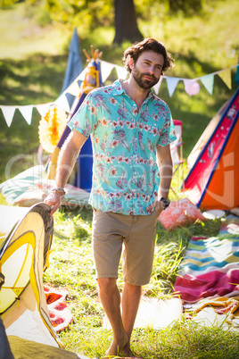 Man standing near campsite