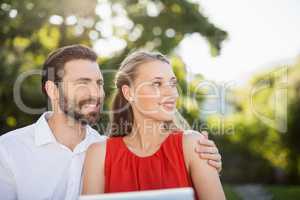 Couple together in park on a sunny day