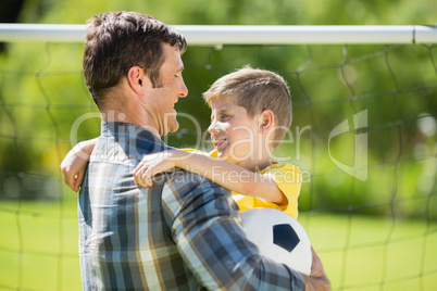 Father hugging son in the park