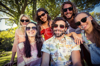 Group of friends smiling in park