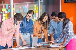 Team of graphic designers discussing in a meeting