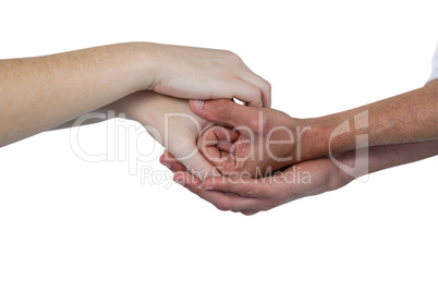 Close-up of hands holding together