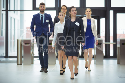 Businesspeople walking in a lobby