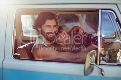 Couple sitting in a campervan