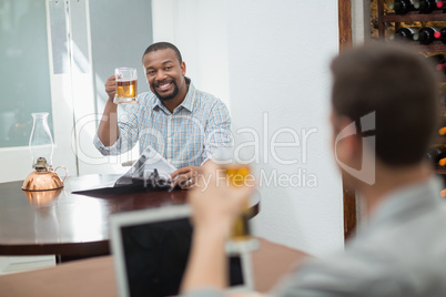 Friends toasting beer glasses