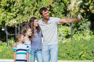 Happy family taking a selfie on mobile phone