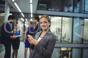 Businesswoman using digital tablet in the passageway