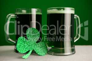 Mug of green beer and shamrock for St Patricks Day