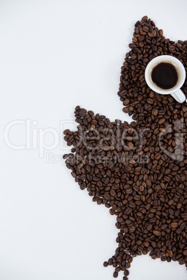 Coffee beans and cups forming owl