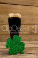 Glass of black beer and shamrock for St Patricks Day