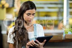 Woman using digital tablet