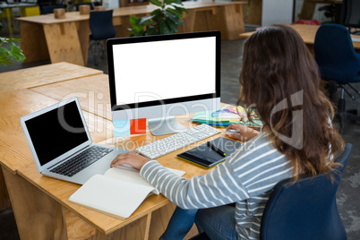 Female graphic designer working at desk