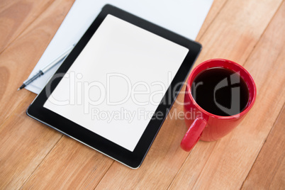 Coffee with digital tablet and paper