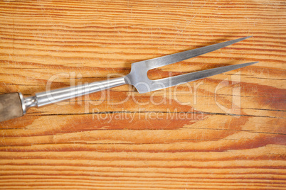 Fork on wooden board