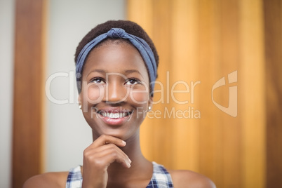 Thoughtful schoolgirl with hand on chin