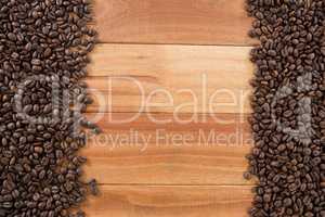 Coffee beans arranged on wooden table