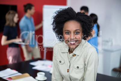 Portrait of smiling business executive at meeting