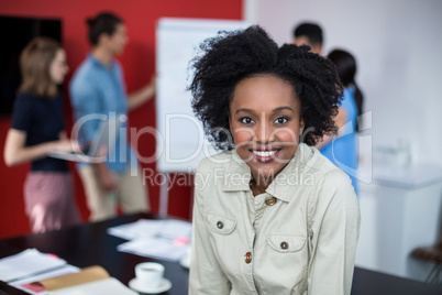 Portrait of smiling business executive at meeting Portrait of smiling business executive at meeting