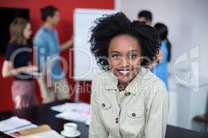 Portrait of smiling business executive at meeting