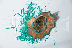Green color pencils shavings on a white background