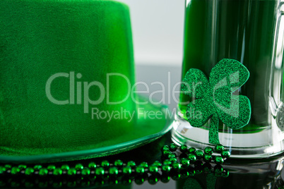 St Patricks Day green beer with shamrock, leprechaun hat and bead