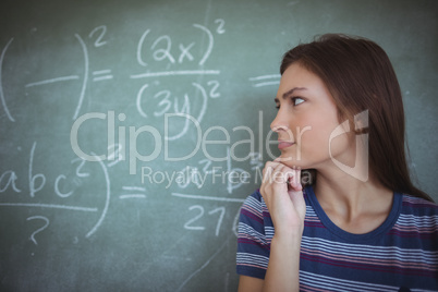 Schoolgirl pretending to be a teacher in classroom