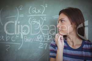 Schoolgirl pretending to be a teacher in classroom