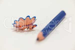 Close-up of blue colored pencil with shavings