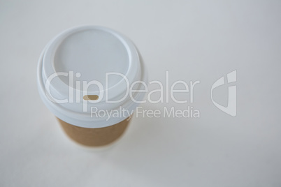 Disposable coffee cup on white background