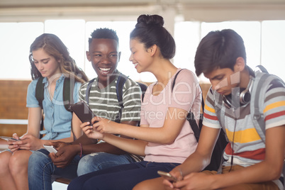 Students using mobile phone in campus