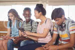 Students using mobile phone in campus