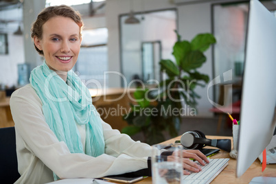 Female graphic designer working at desk