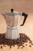 Metallic coffee maker with coffee beans