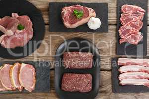 Varieties of meat on black tray
